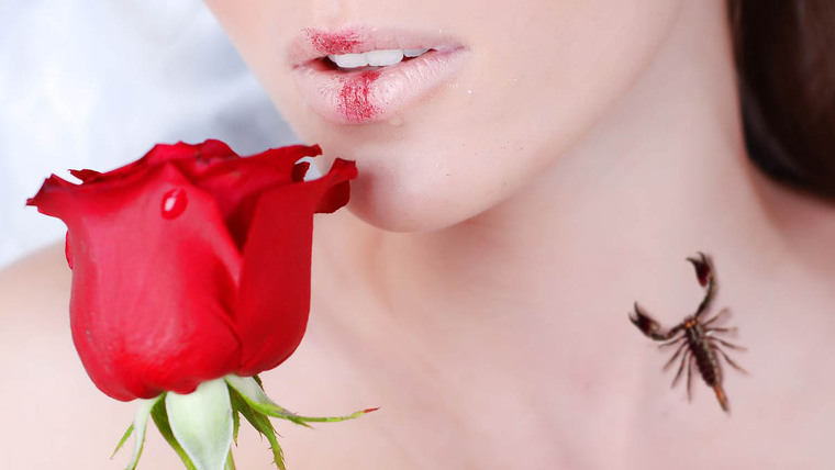 Woman with a rose and a scorpion on her neck.