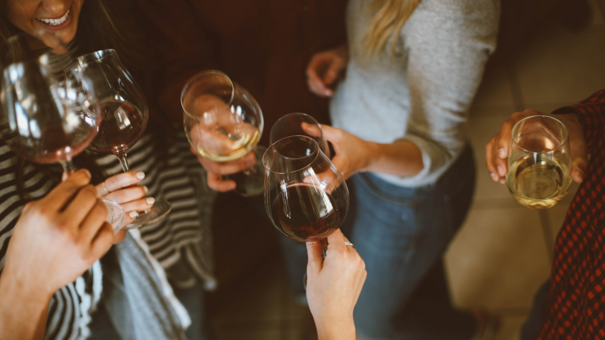 People celebrating with wine during a party