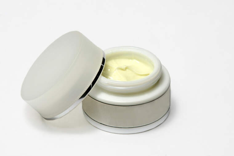 A face cream with its lid on top