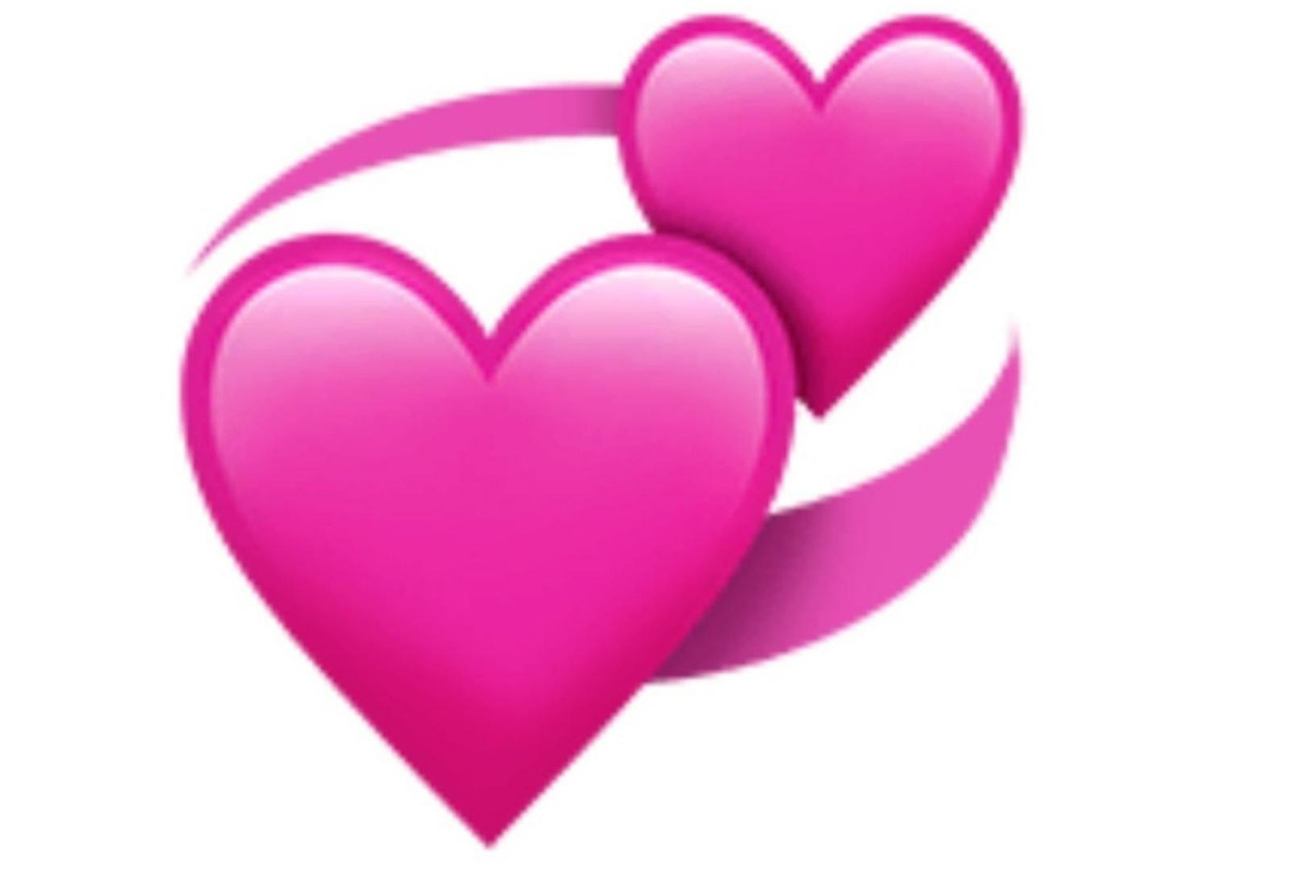 Emoji de corazones unidos y girando
