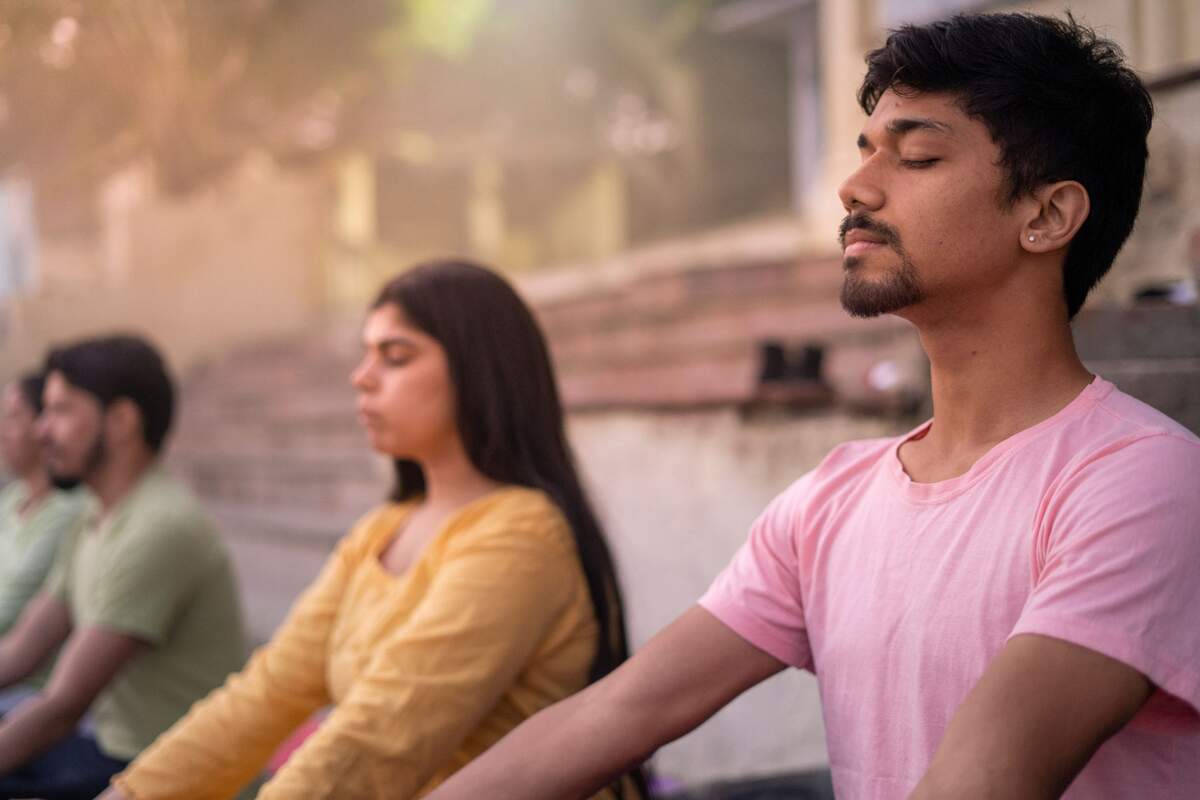 People sitting meditating and relaxing