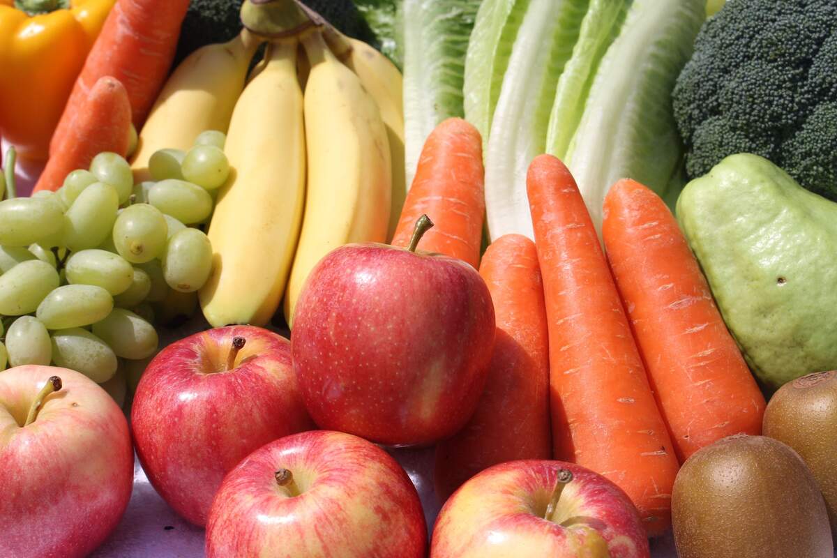 An image of apples and vegetables on the table