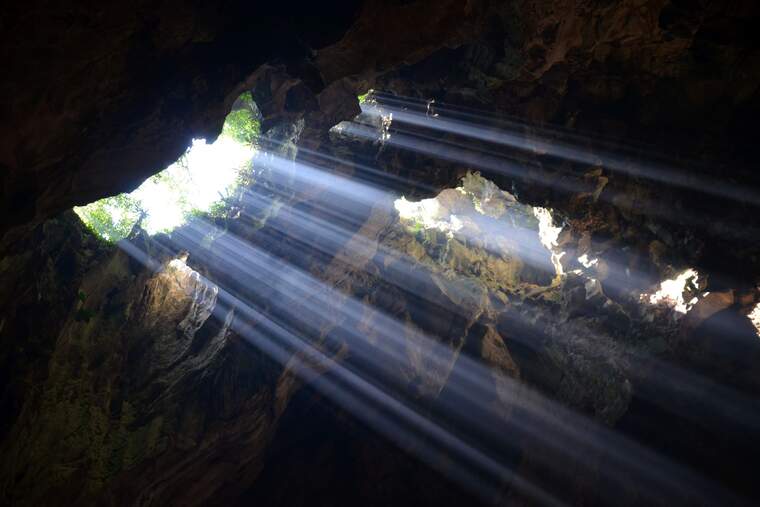 The interior of a cave with light coming in